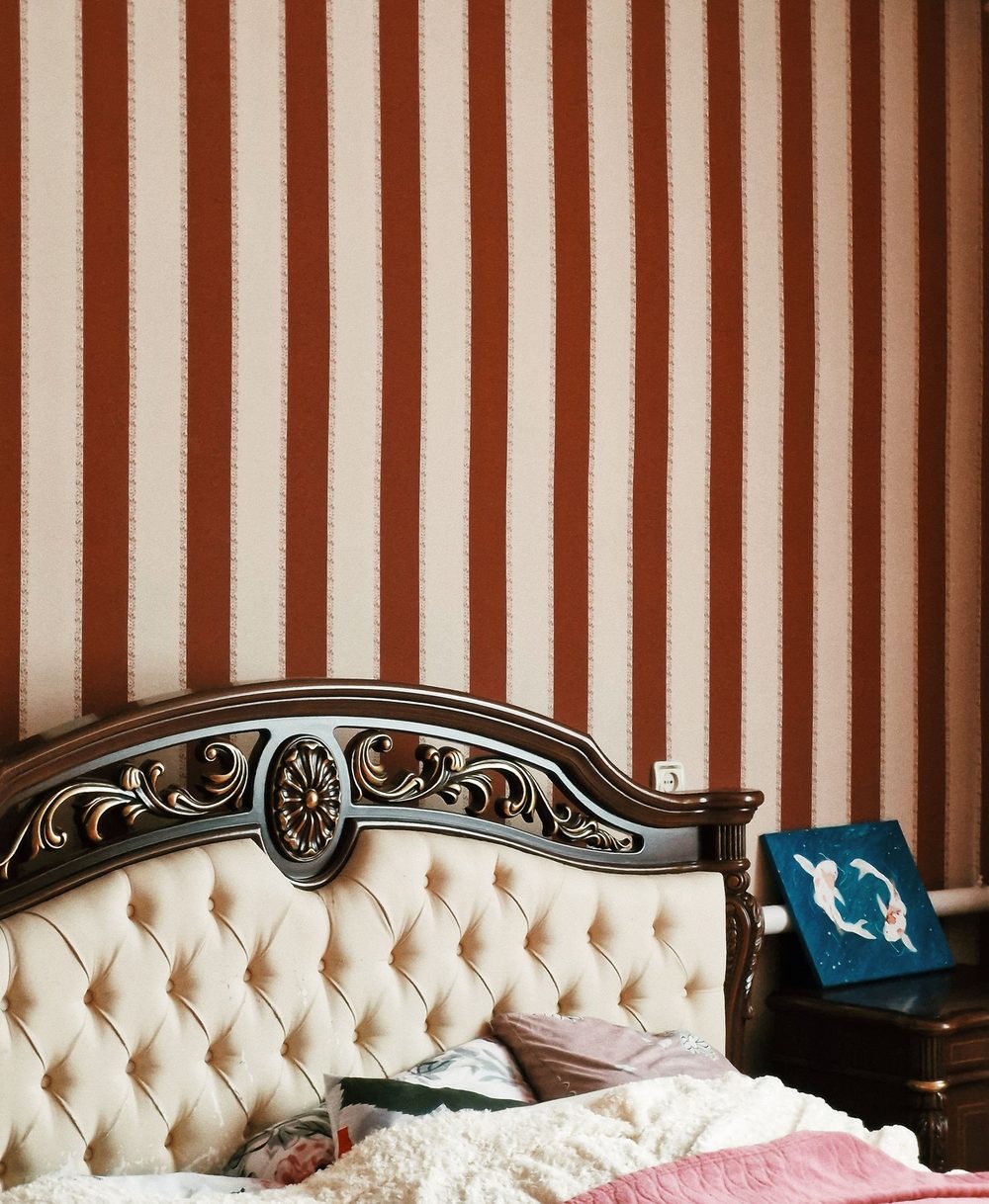Bedroom feature wall in a warm terracotta stripe